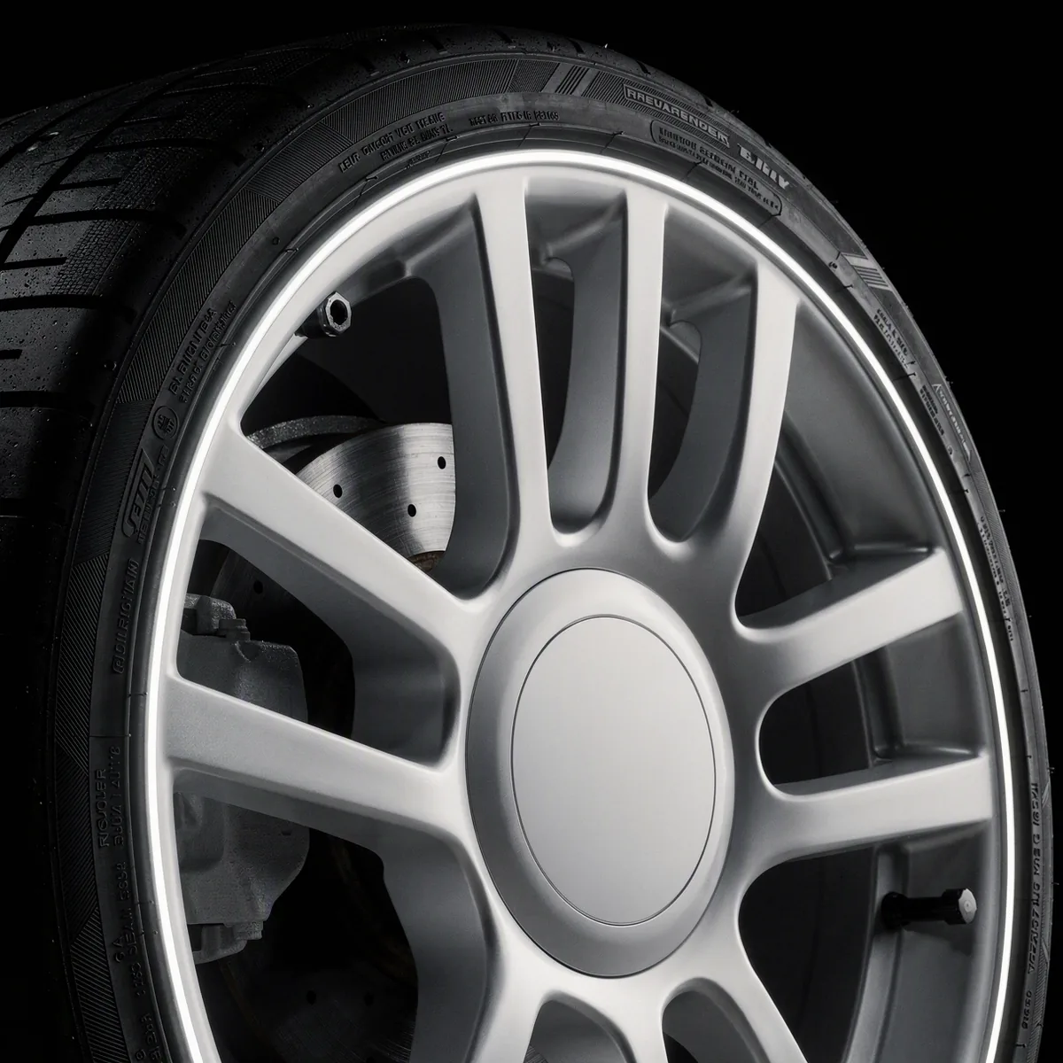 Close-up of an alloy wheel and tire sidewall
